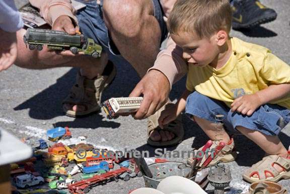 boy with toy trucks graphic